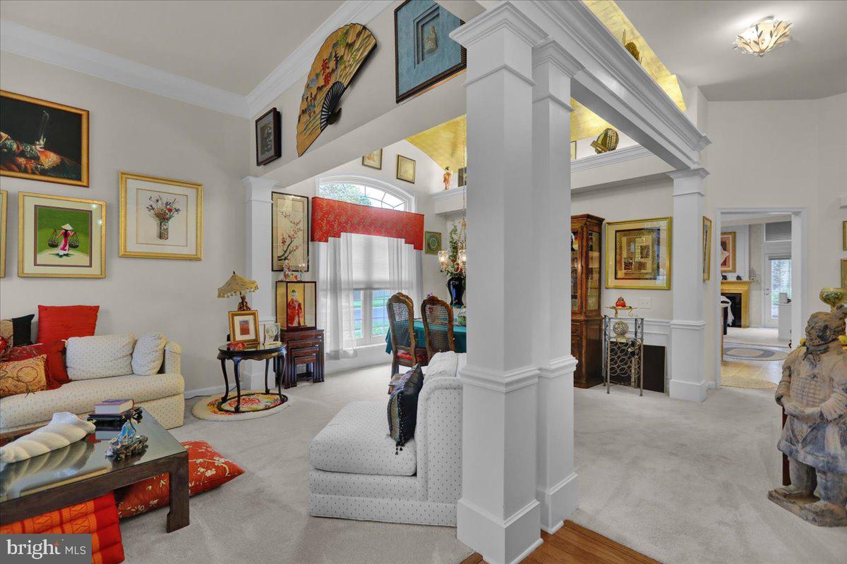 213 Aster Circle Kennett Square, PA 19348 - Photo 8 of 39 a living room with furniture and a large window