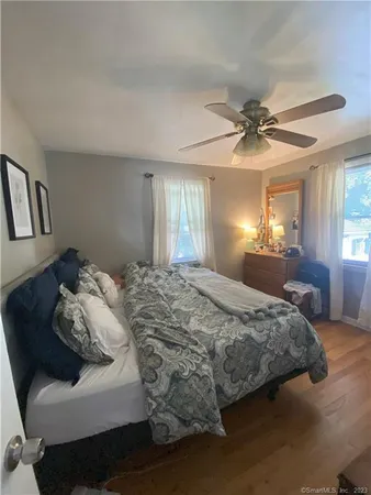 a bedroom with a bed and window