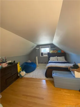 a bedroom with a bed and cabinets