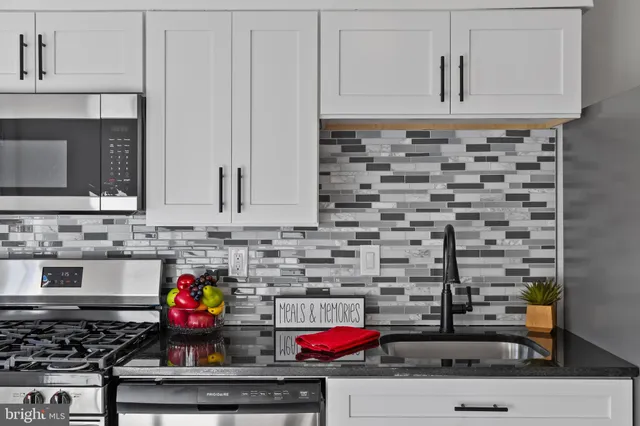 a kitchen with a stove and cabinets