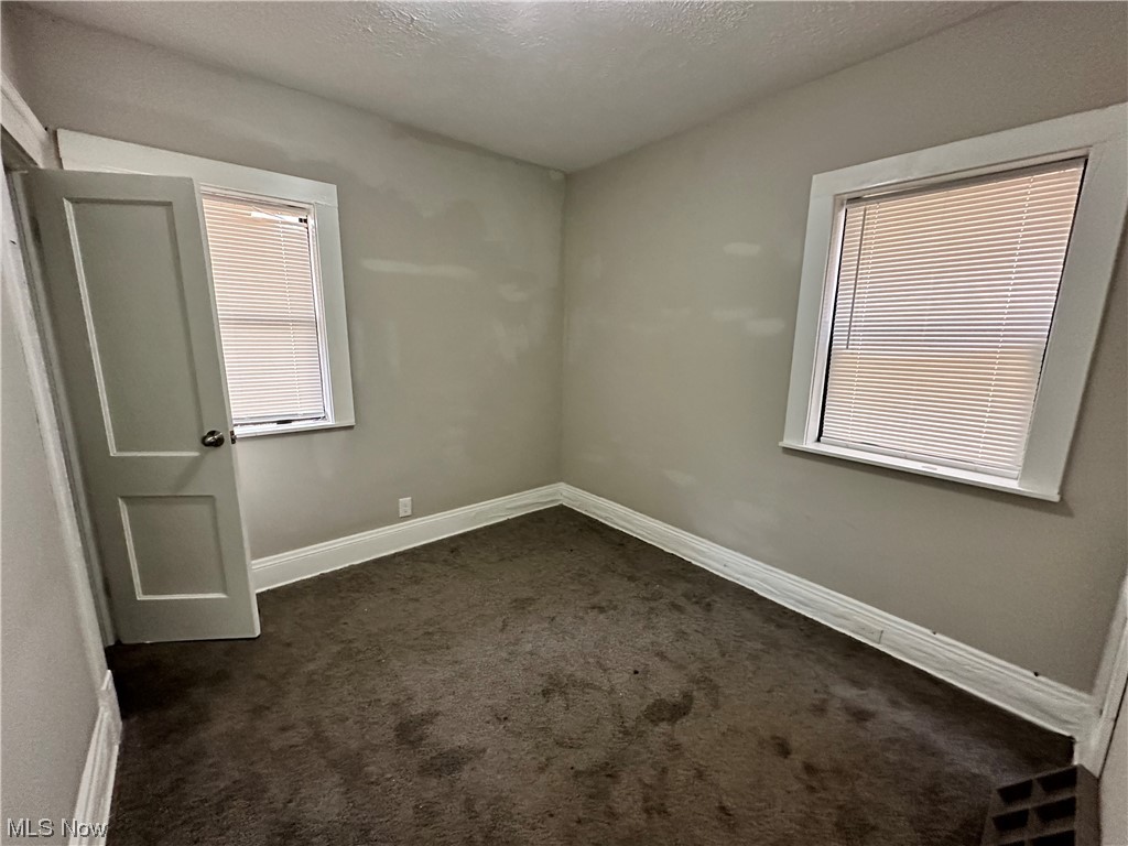 6734 Ottawa Road Cleveland, OH 44105 - Photo 16 of 31 Spare room featuring dark colored carpet