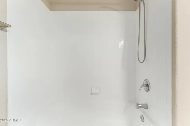 a bathroom with a bath tub