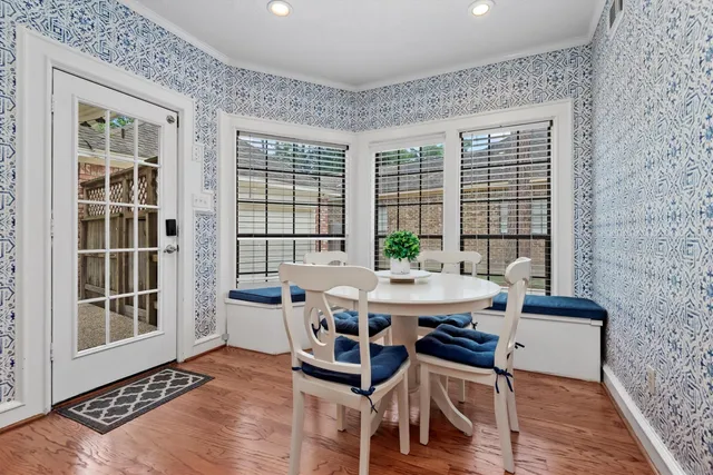 a view of a dining room with furniture window and wooden floor
