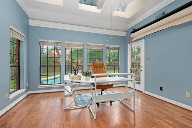 a living room filled with furniture and a large window