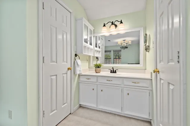 a bathroom with a double vanity sink and a mirror