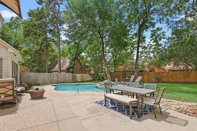 a view of a chairs and tables in the backyard