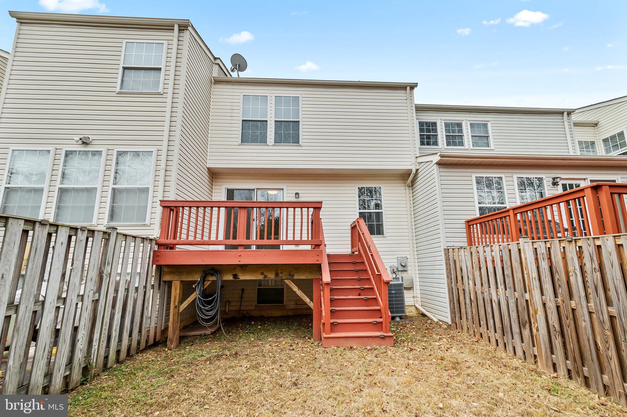 10305 Butternut Circle Manassas, VA 20110 - Photo 16 of 29 a view of a house with wooden deck