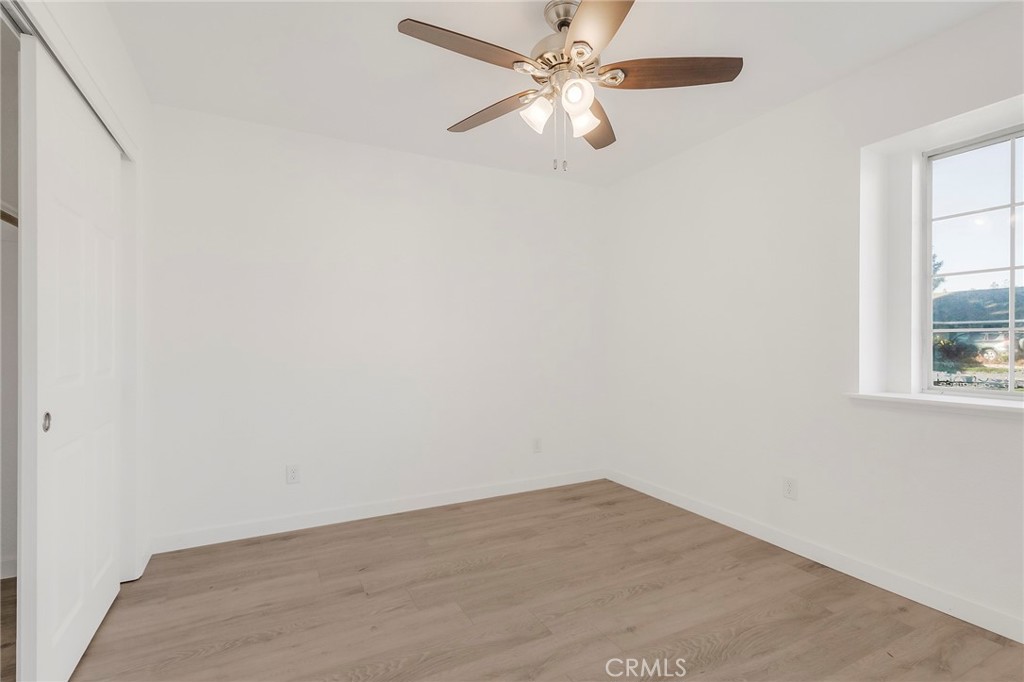 4 Cloud Court Chico, CA 95928 - Photo 26 of 46 an empty room with a window and a fan
