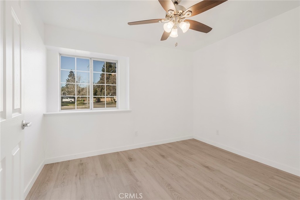4 Cloud Court Chico, CA 95928 - Photo 28 of 46 an empty room with a window and a fan