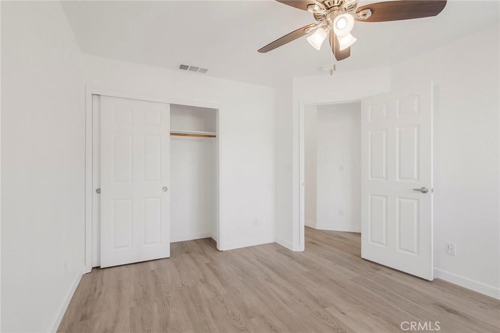 4 Cloud Court Chico, CA 95928 - Photo 29 of 46 an empty room with wooden floor closet and windows