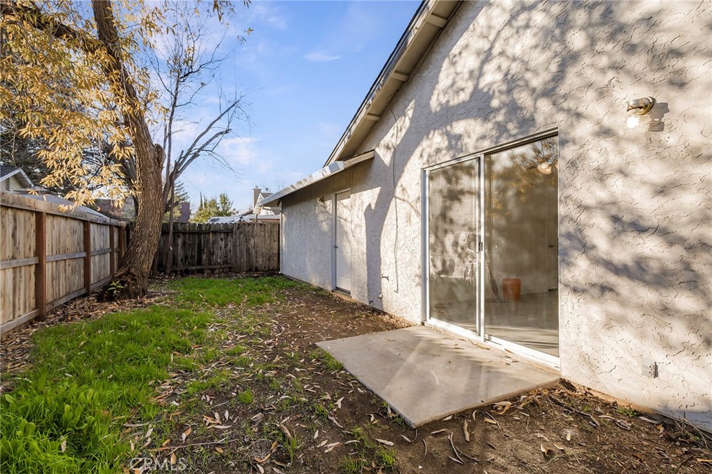 4 Cloud Court Chico, CA 95928 - Photo 34 of 46 a backyard of a house with lots of green space