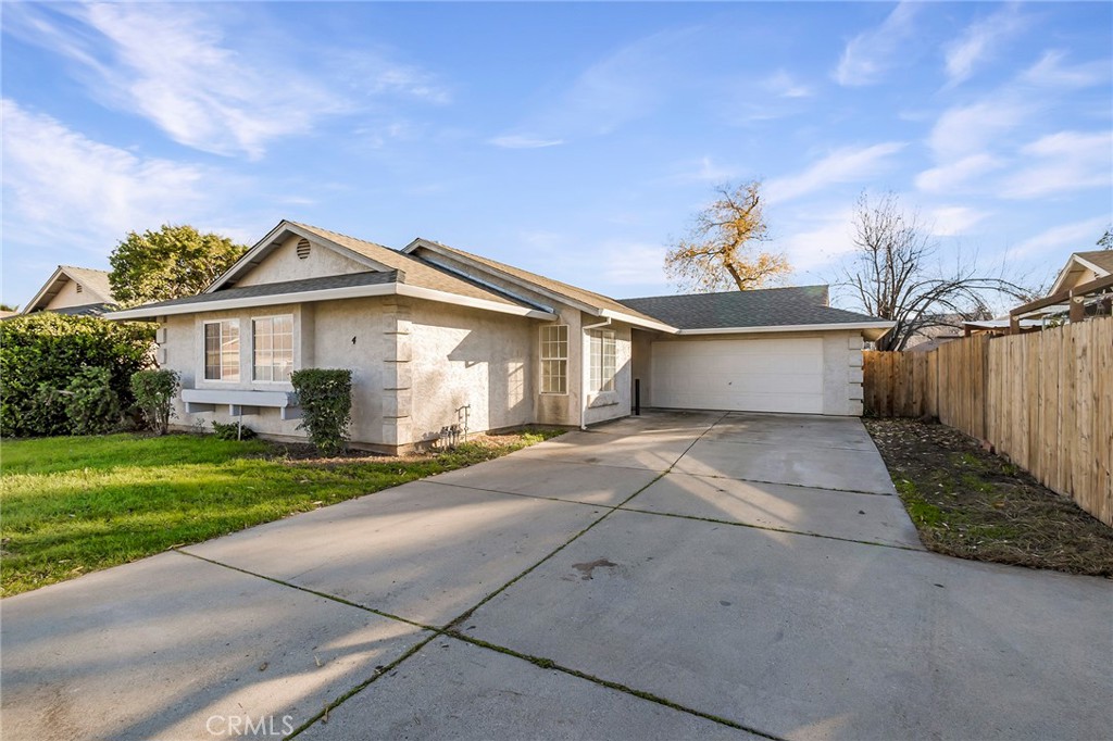 4 Cloud Court Chico, CA 95928 - Photo 4 of 46 a front view of a house with a yard and garage