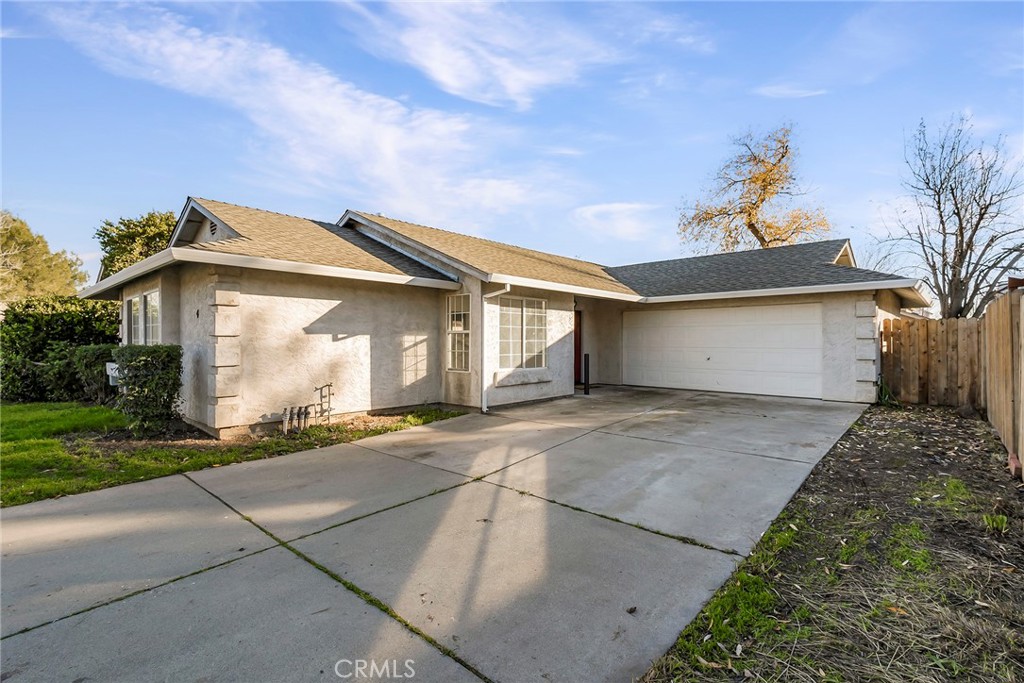 4 Cloud Court Chico, CA 95928 - Photo 5 of 46 a front view of a house with a yard and garage