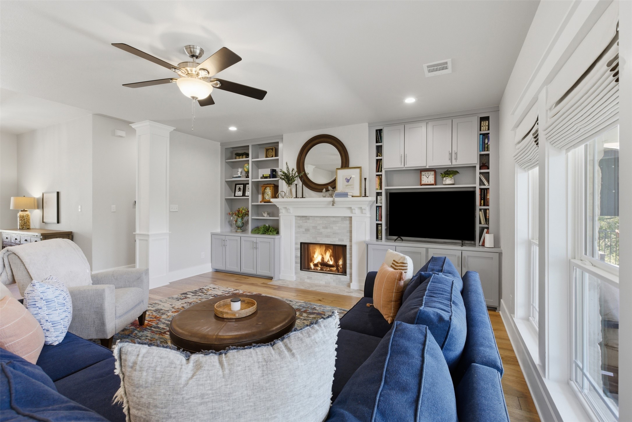 1804 Tanner Loop Taylor, TX 76574 - Photo 6 of 40 The living room offers ambient light with abundant natural light and recessed lighting accents.