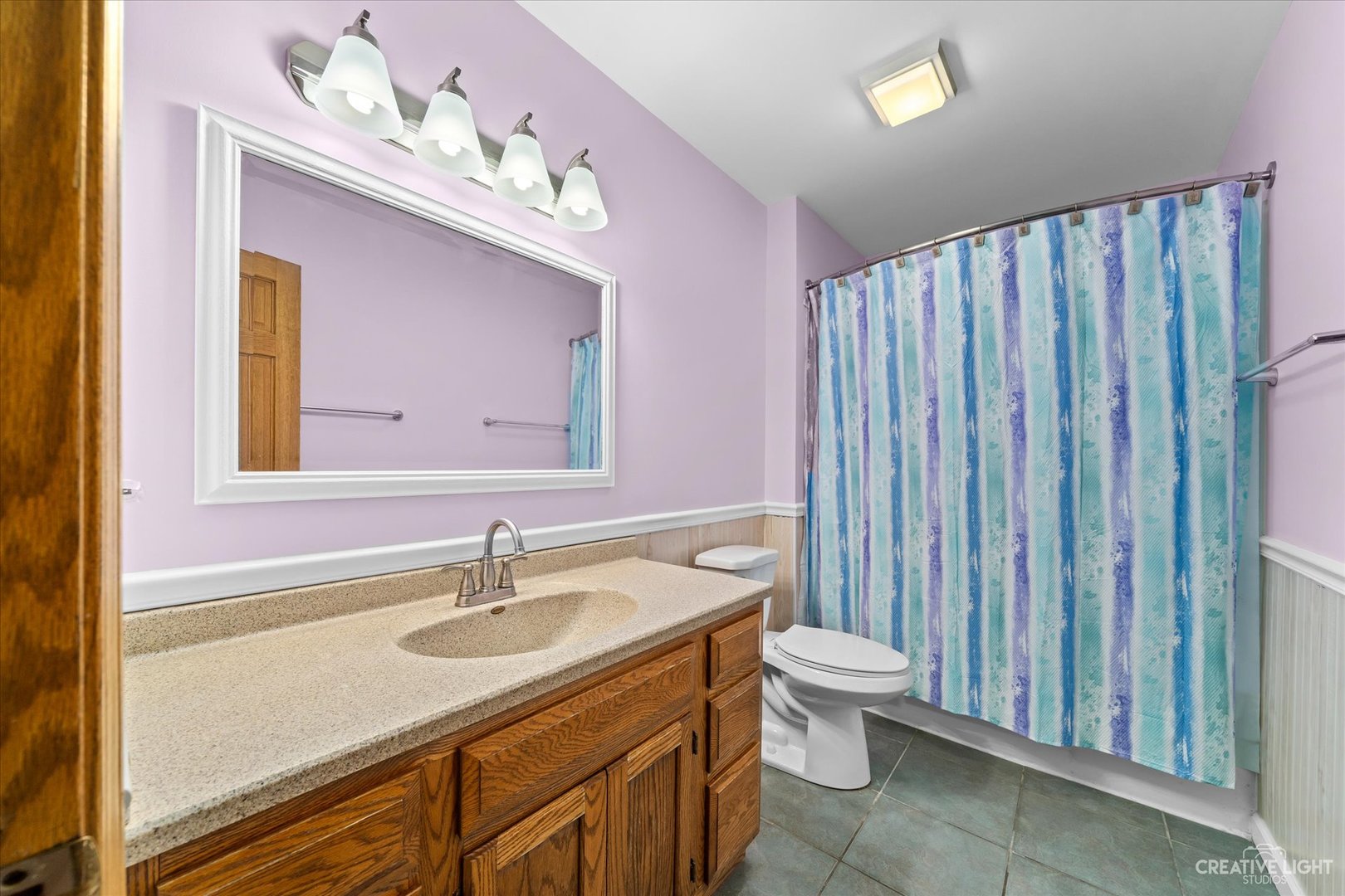 41-w492 Rohrsen Road Hampshire, IL 60140 - Photo 29 of 39 a bathroom with a sink a toilet and a mirror