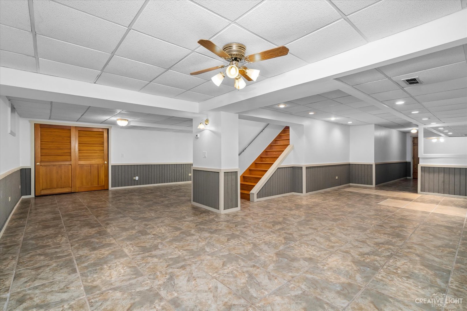 41-w492 Rohrsen Road Hampshire, IL 60140 - Photo 33 of 39 a view of an empty room with a chandelier fan and fire place