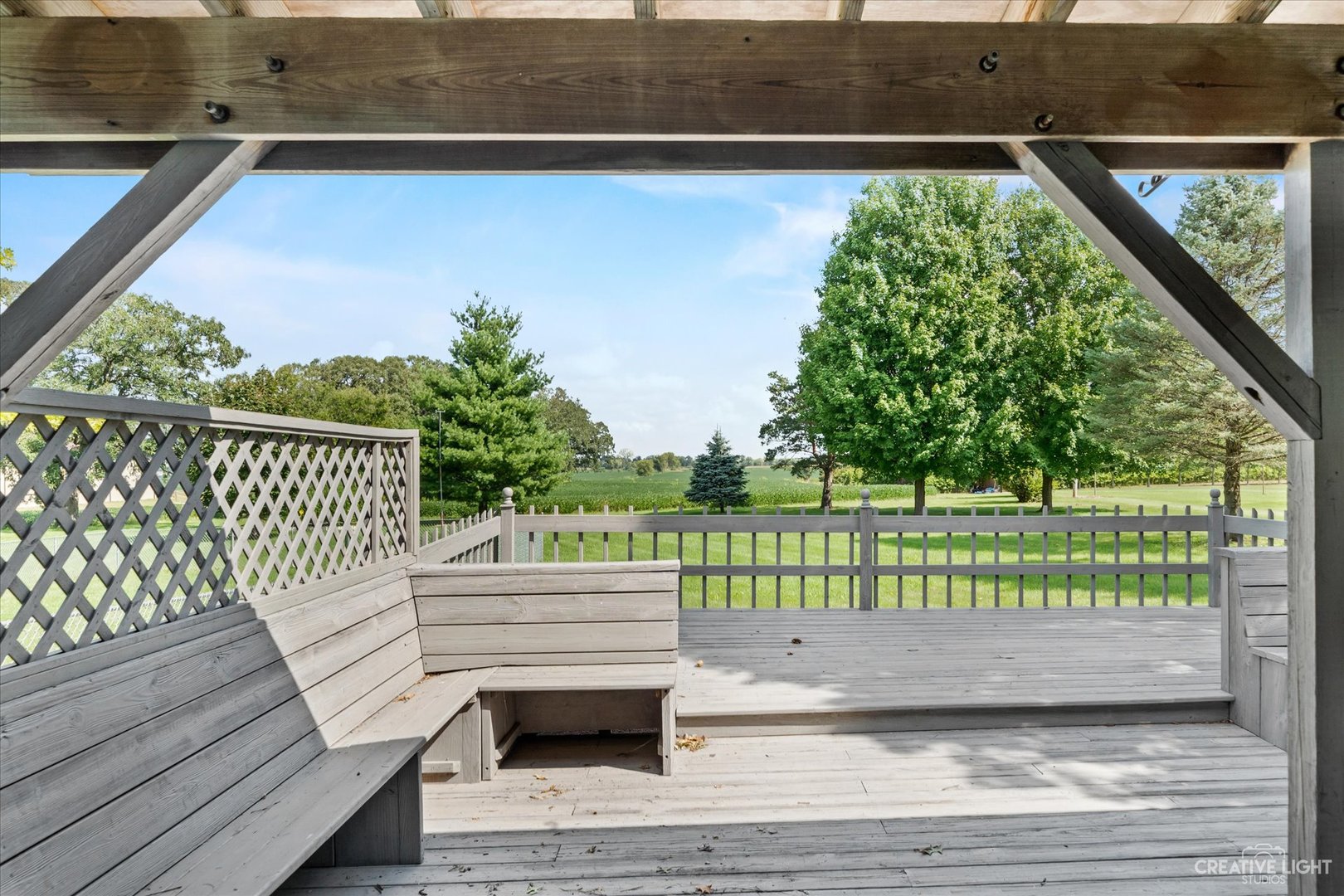 41-w492 Rohrsen Road Hampshire, IL 60140 - Photo 34 of 39 a view of a wooden deck with a bench