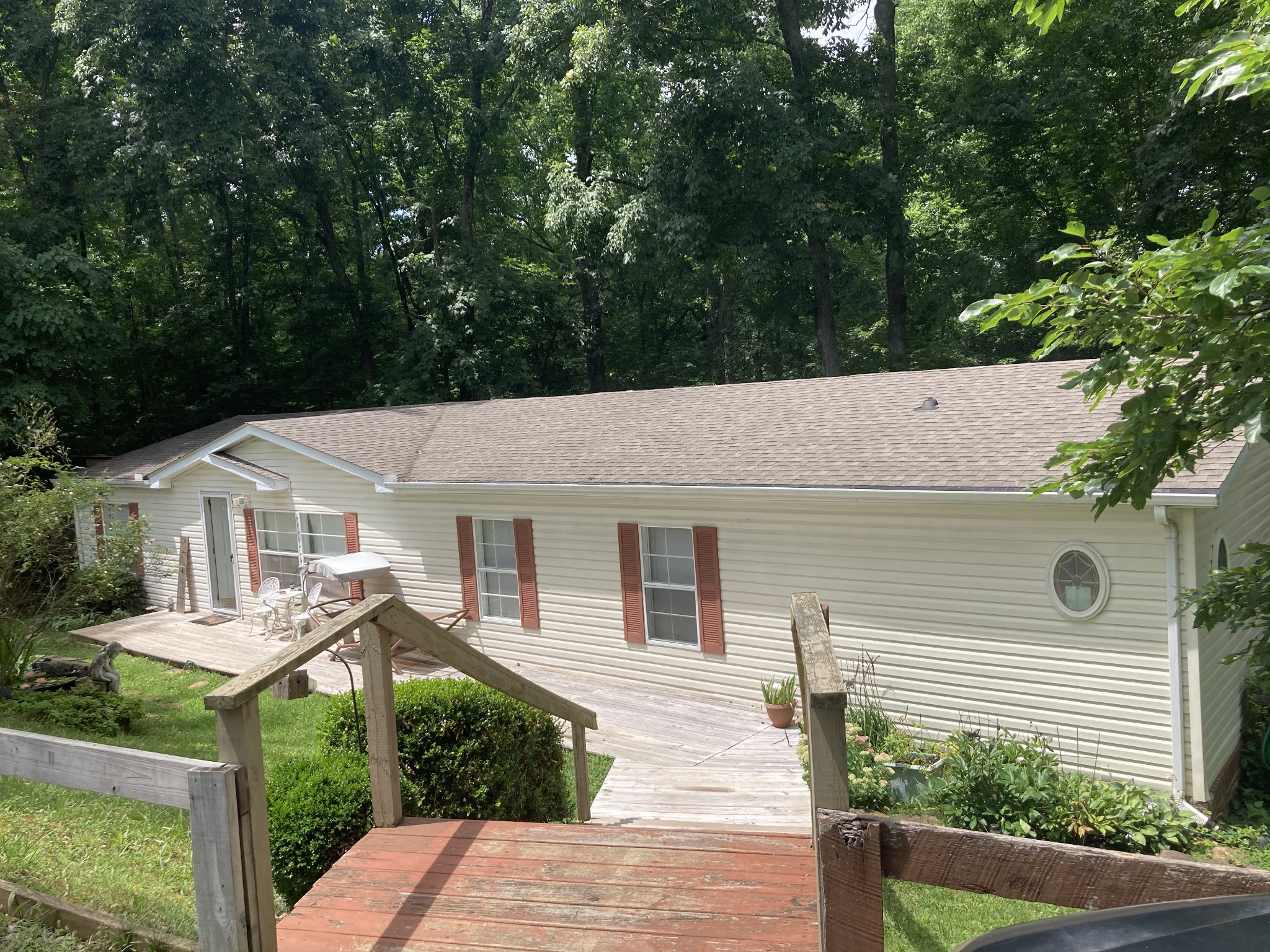 7549 King Road Fairview, TN 37062 - Photo 1 of 29 a view of a white house with a small yard and large tree