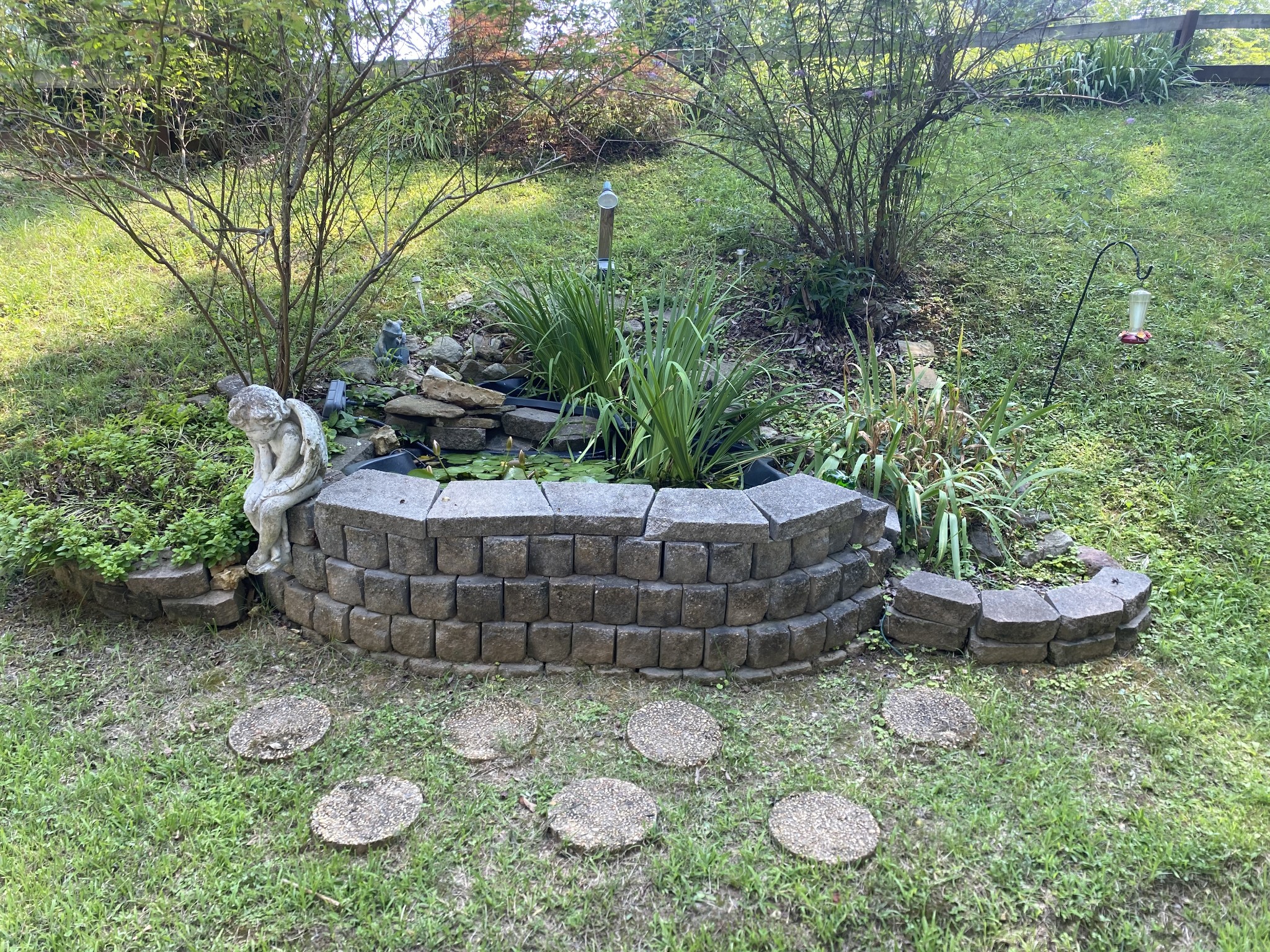 7549 King Road Fairview, TN 37062 - Photo 4 of 29 a view of a backyard with table and chairs plants and large trees