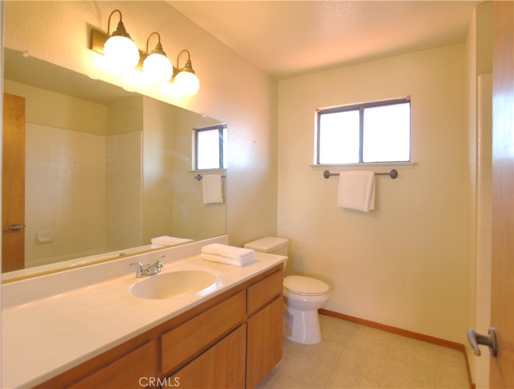 36116 Sharon Way Yucaipa, CA 92399 - Photo 18 of 34 a bathroom with a sink and a mirror