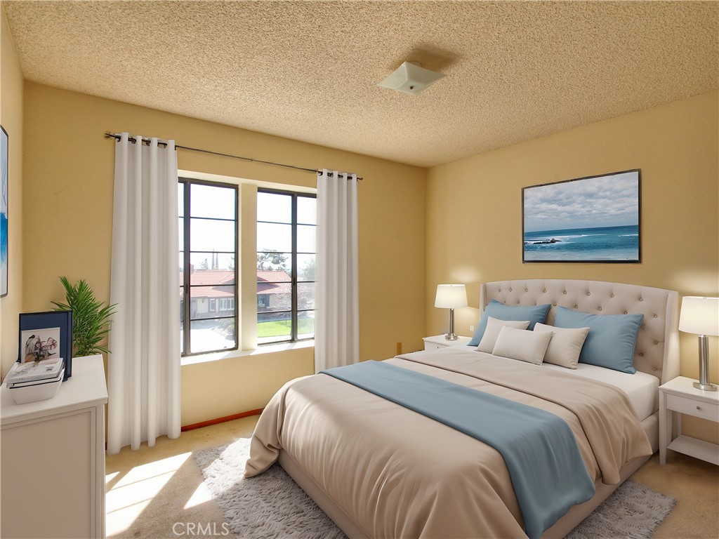 36116 Sharon Way Yucaipa, CA 92399 - Photo 21 of 34 a bedroom with a bed painting on wall and a large window