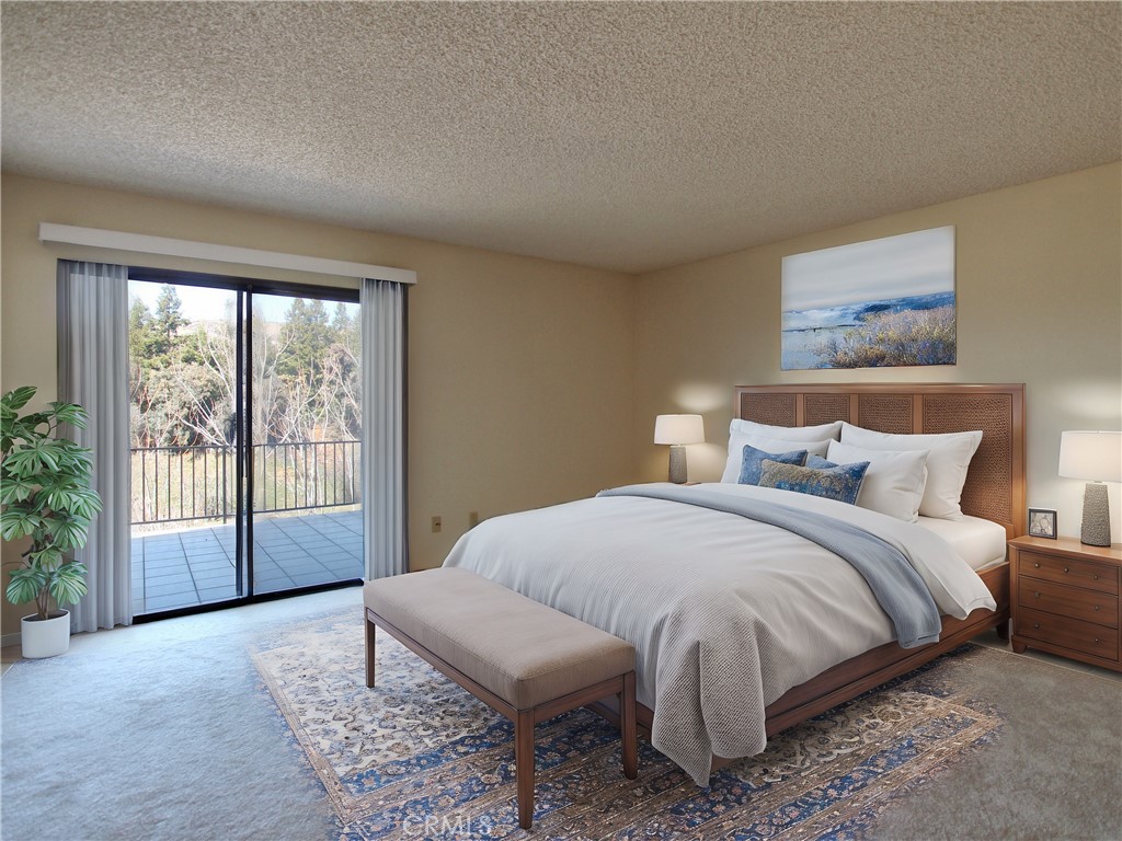 36116 Sharon Way Yucaipa, CA 92399 - Photo 22 of 34 a spacious bedroom with a bed and a large window