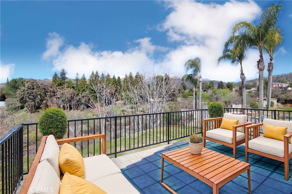 36116 Sharon Way Yucaipa, CA 92399 - Photo 26 of 34 a view of a balcony with lake view and wooden floor