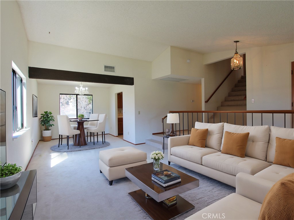 36116 Sharon Way Yucaipa, CA 92399 - Photo 8 of 34 a living room with furniture potted plant and a large window