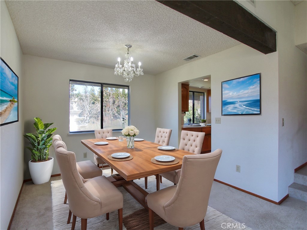 36116 Sharon Way Yucaipa, CA 92399 - Photo 9 of 34 a view of a dining room with furniture window and wooden floor