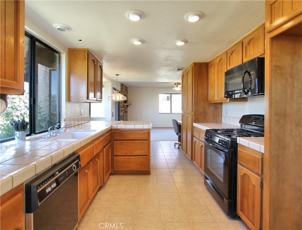 36116 Sharon Way Yucaipa, CA 92399 - Photo 10 of 34 a large kitchen with stainless steel appliances lots of counter top space