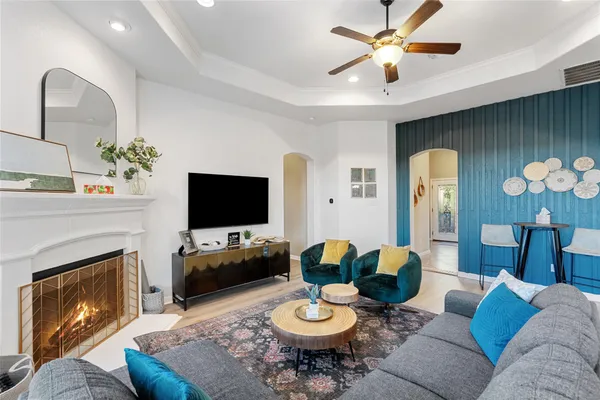 a living room with furniture and a fireplace
