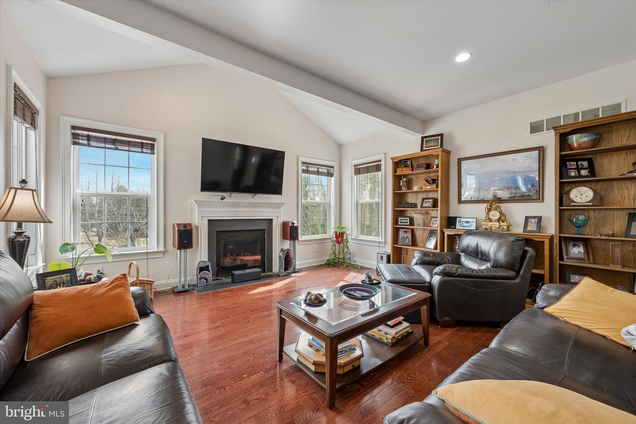 301 Jennifer Lane Exton, PA 19341 - Photo 15 of 41 a living room with furniture a fireplace and a flat screen tv