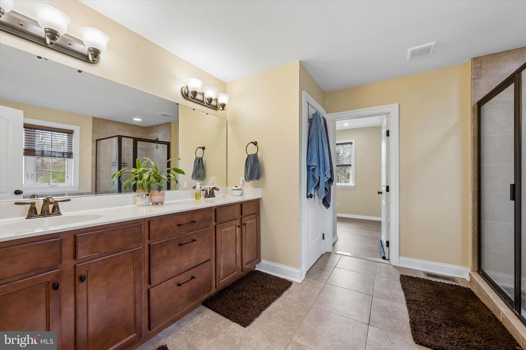 301 Jennifer Lane Exton, PA 19341 - Photo 23 of 41 a spacious bathroom with a double vanity sink a mirror and a shower