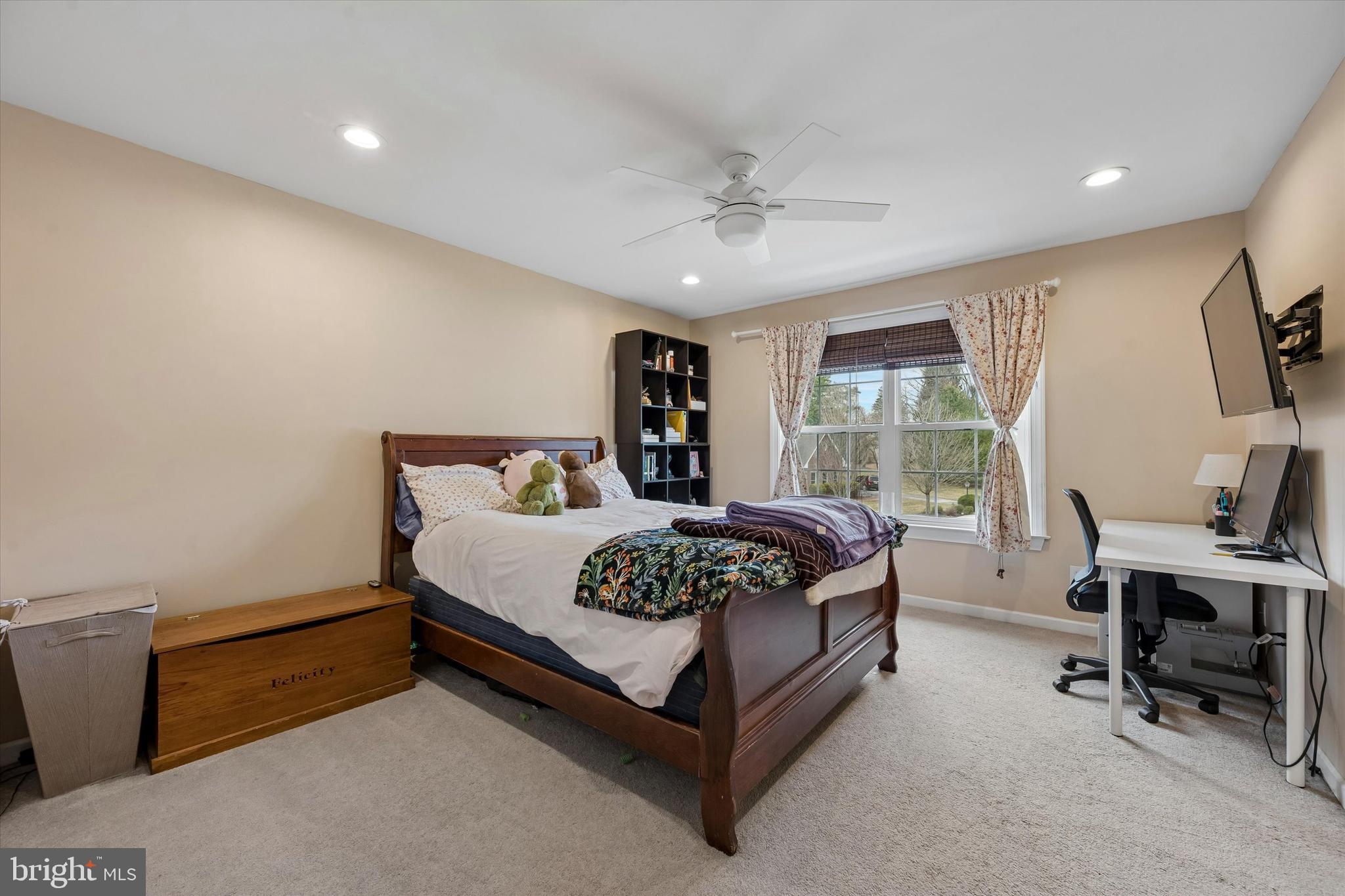 301 Jennifer Lane Exton, PA 19341 - Photo 28 of 41 a bedroom with a bed a desk and chair