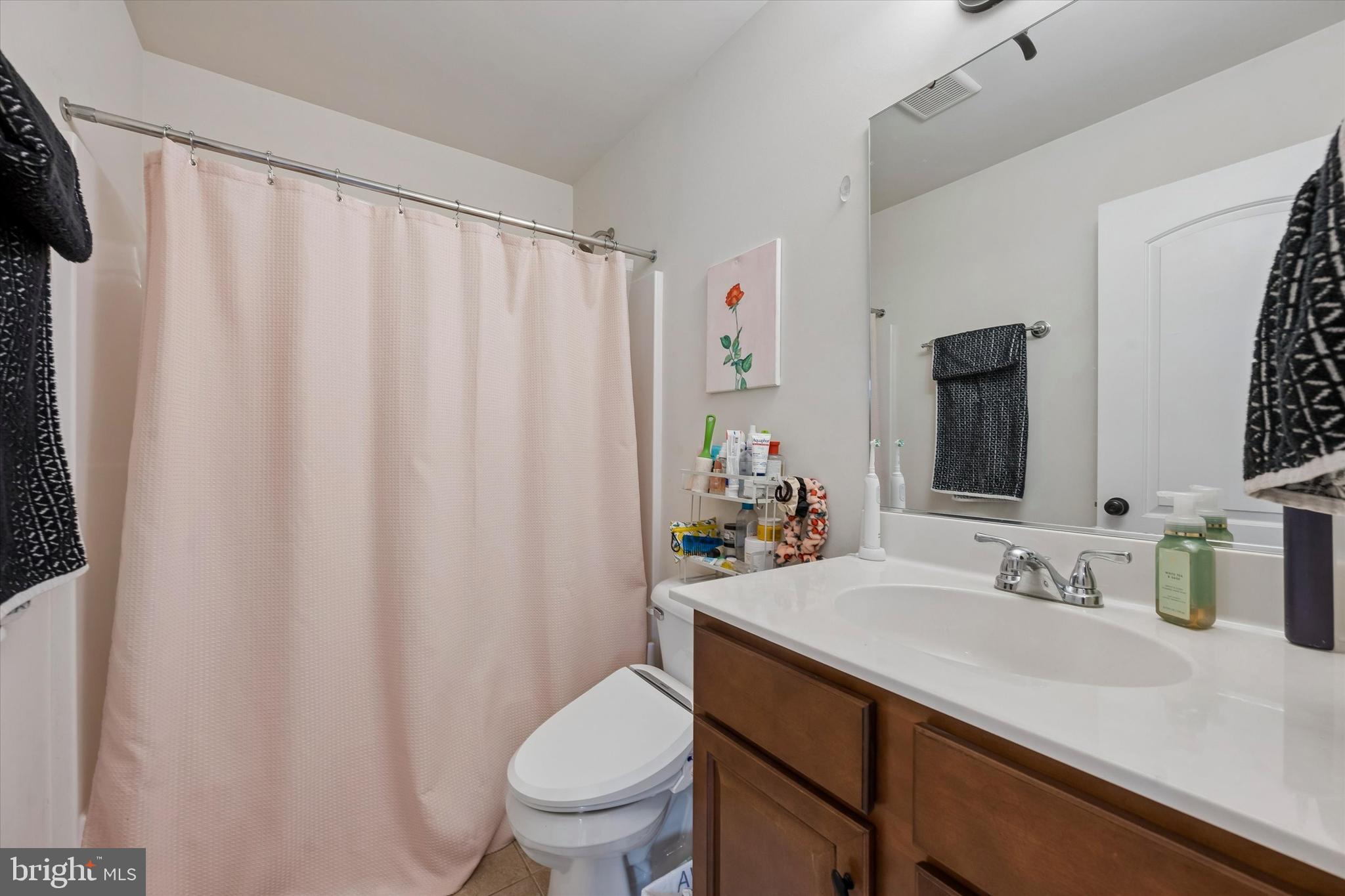 301 Jennifer Lane Exton, PA 19341 - Photo 29 of 41 a bathroom with a sink a toilet and a mirror