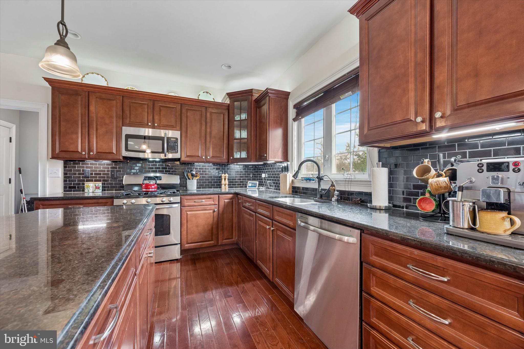 301 Jennifer Lane Exton, PA 19341 - Photo 8 of 41 a kitchen with stainless steel appliances wooden cabinets granite counter tops and a window