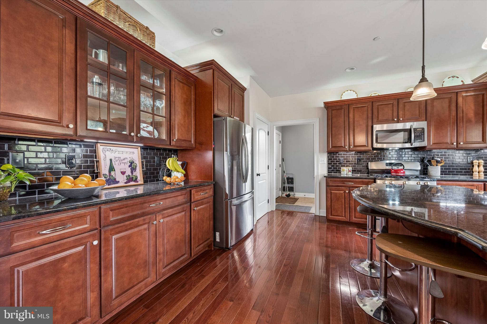 301 Jennifer Lane Exton, PA 19341 - Photo 10 of 41 a kitchen with stainless steel appliances granite countertop a stove a sink dishwasher and a refrigerator with wooden floor