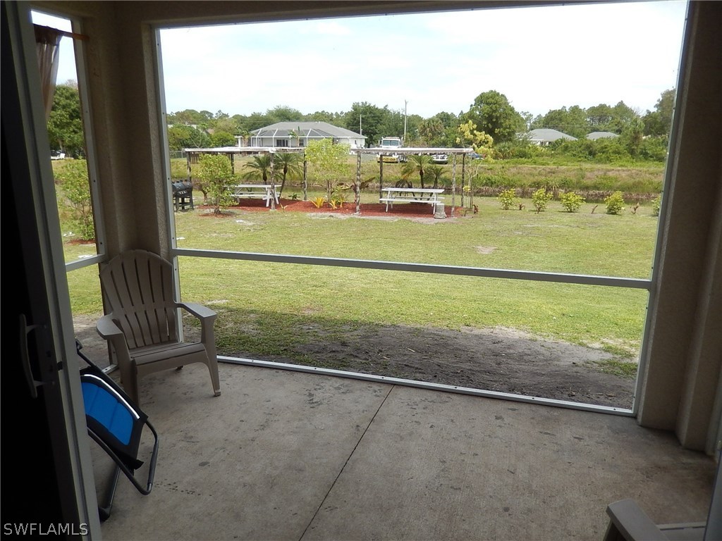 425 Jourferie Road Lehigh Acres, FL 33974 - Photo 12 of 25 a view of a room with lake view and mountain view