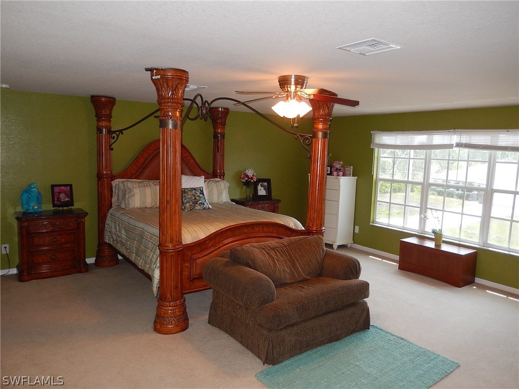 425 Jourferie Road Lehigh Acres, FL 33974 - Photo 15 of 25 a living room with furniture and a window