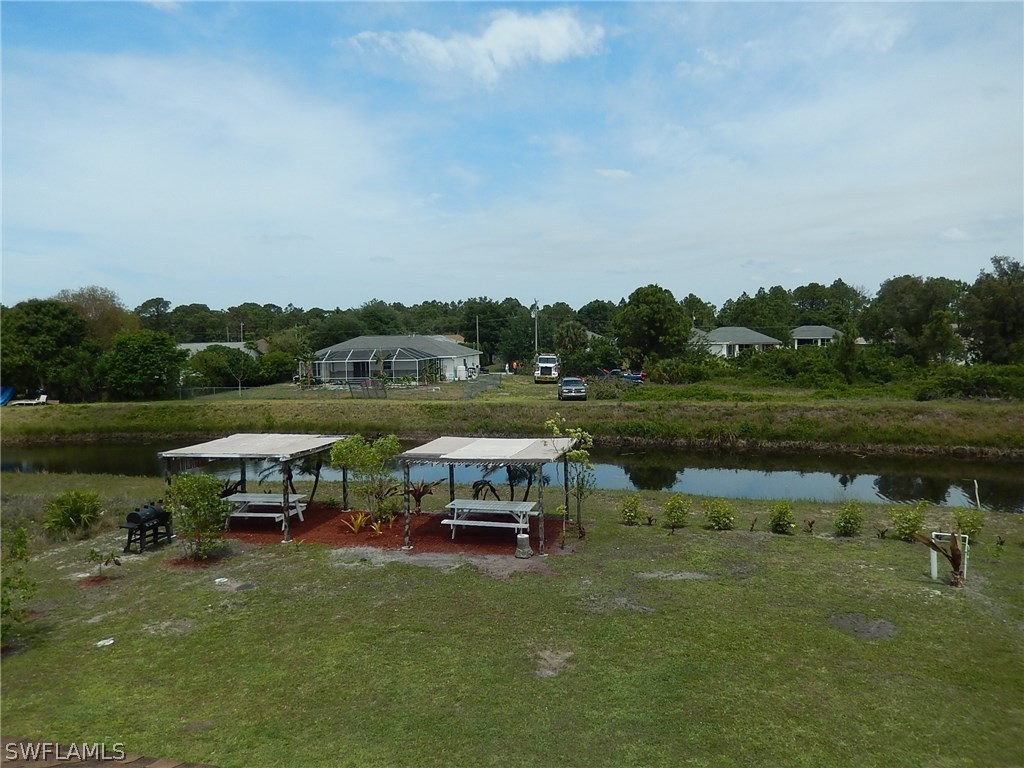 425 Jourferie Road Lehigh Acres, FL 33974 - Photo 23 of 25 a view of a lake with outdoor space