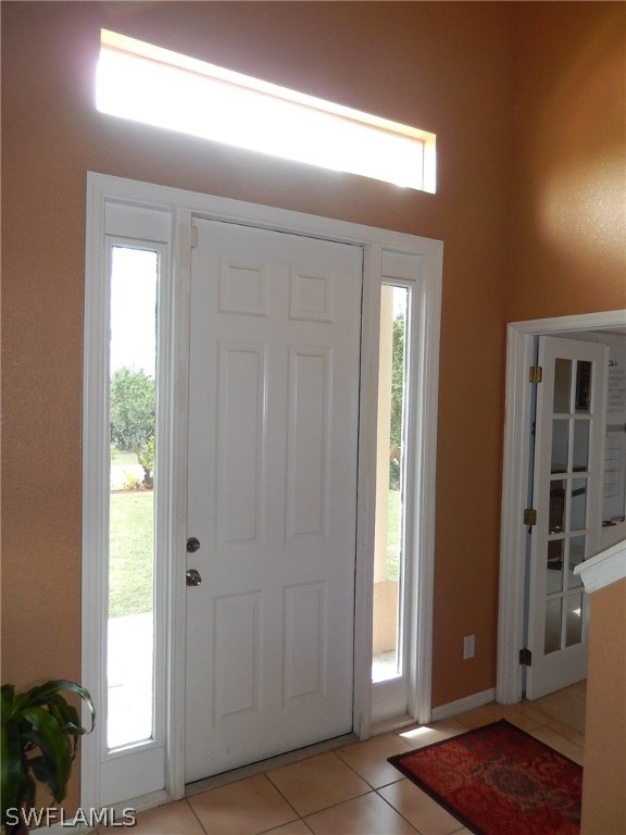 425 Jourferie Road Lehigh Acres, FL 33974 - Photo 4 of 25 an empty room with windows