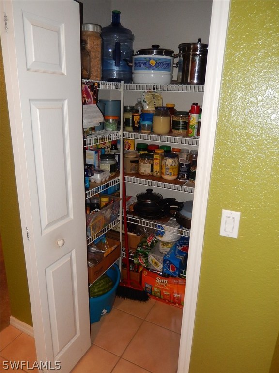 425 Jourferie Road Lehigh Acres, FL 33974 - Photo 8 of 25 a room with storage and utility