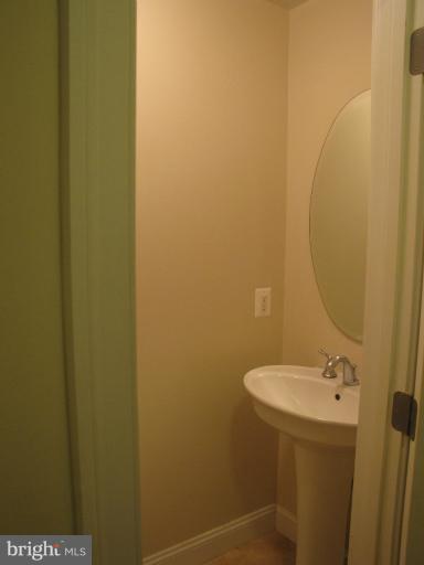 1740 18th Street Northwest, Unit 104 Washington, DC 20009 - Photo 2 of 13 a bathroom with a sink and mirror
