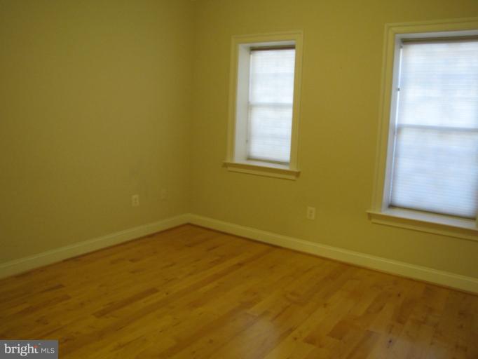 1740 18th Street Northwest, Unit 104 Washington, DC 20009 - Photo 12 of 13 a view of an empty room with a window