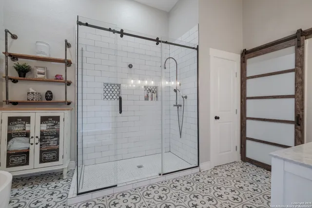 a bathroom with a shower and a sink