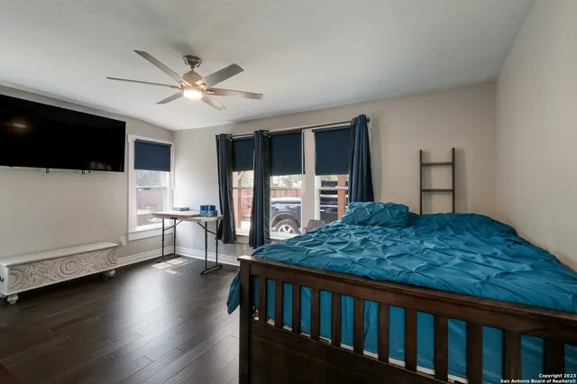 a view of a livingroom with furniture and a flat screen tv
