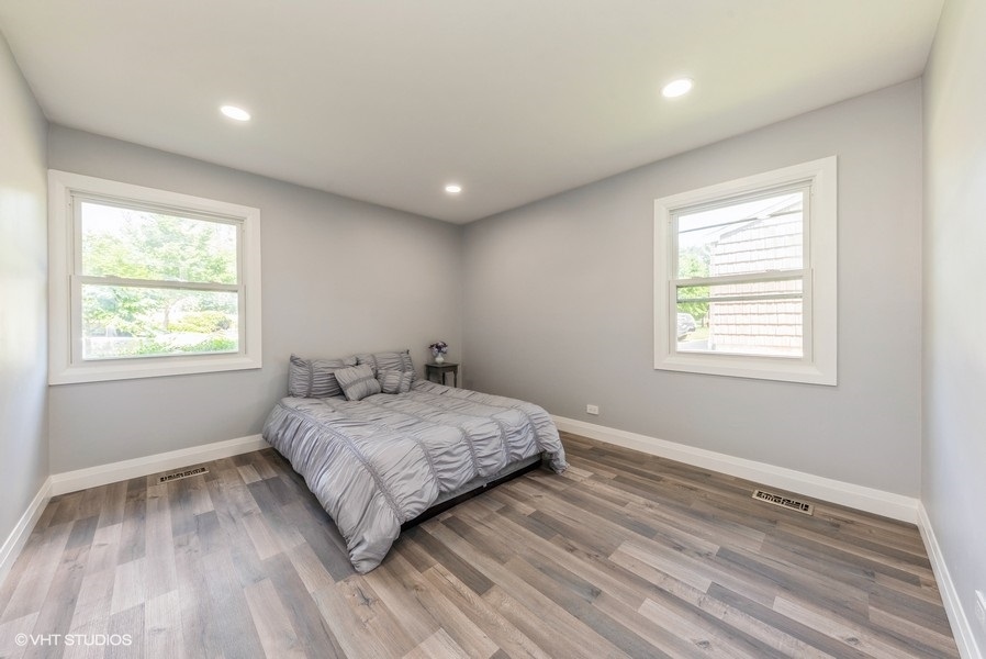 135 Timber Hill Road Buffalo Grove, IL 60089 - Photo 15 of 22 a bedroom with a bed and a window