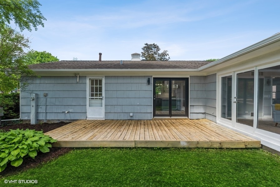 135 Timber Hill Road Buffalo Grove, IL 60089 - Photo 19 of 22 a view of a house with a small yard and plants