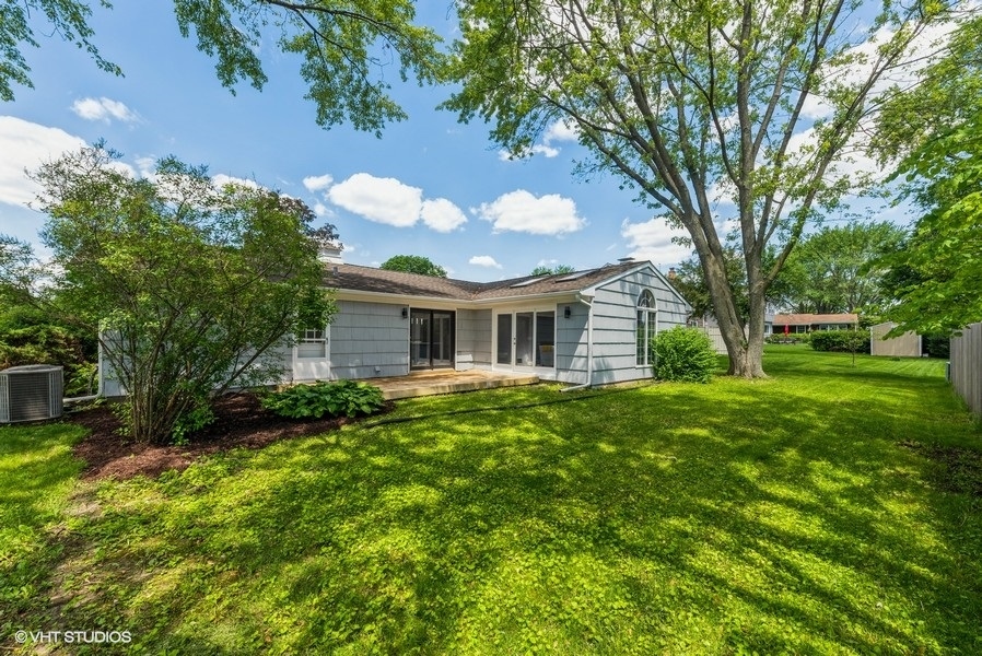 135 Timber Hill Road Buffalo Grove, IL 60089 - Photo 20 of 22 a front view of a house with garden