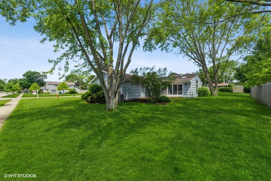 135 Timber Hill Road Buffalo Grove, IL 60089 - Photo 21 of 22 a front view of a house with garden